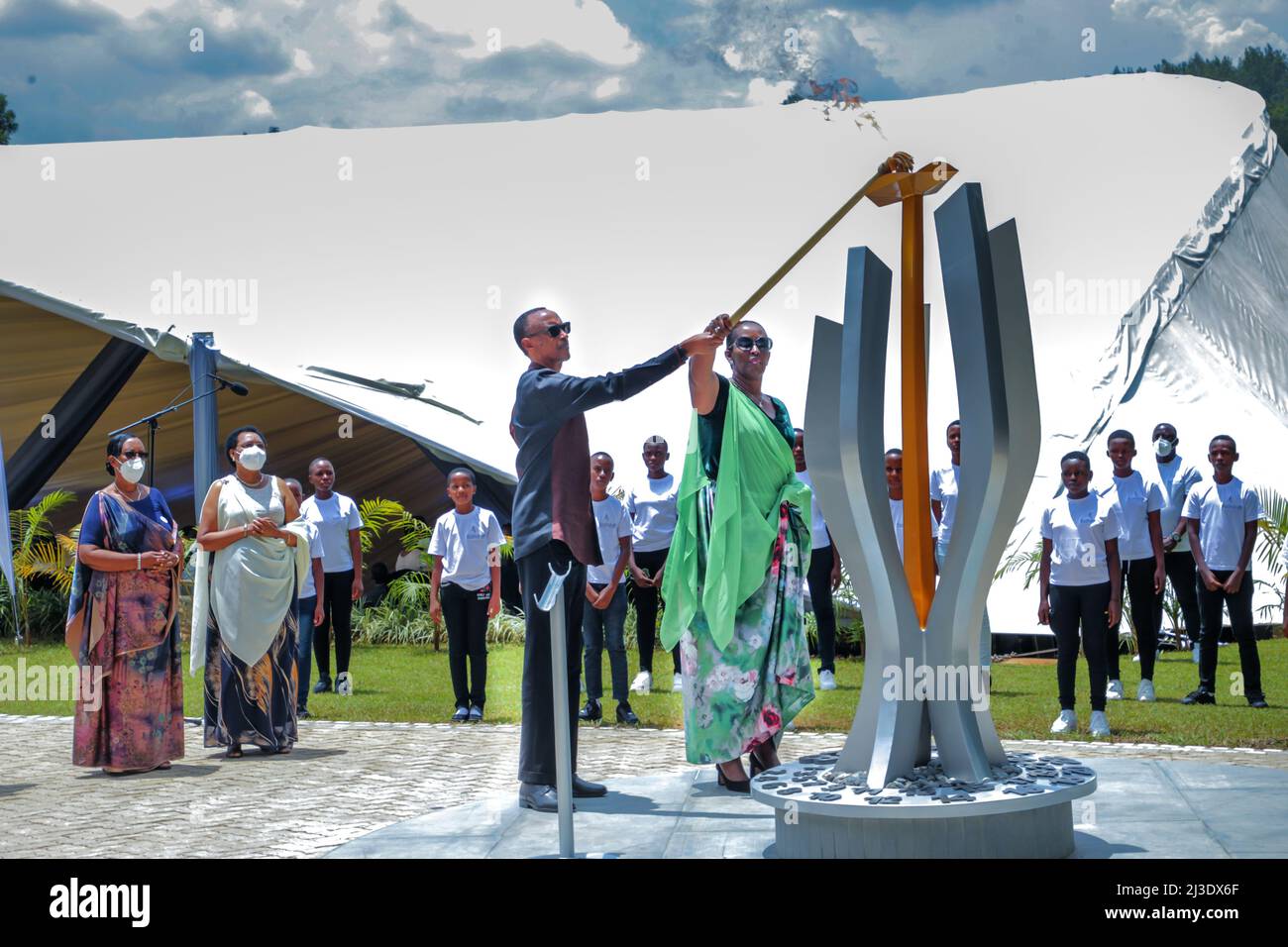 Kigali, Rwanda. 7th Apr, 2022. Rwandan President Paul Kagame (C) and first lady Jeannette Kagame light a flame of remembrance at the Kigali Genocide Memorial in Kigali, capital city of Rwanda, on April 7, 2022. Rwandan President Paul Kagame on Thursday slammed countries covering up acts of the perpetrators of the 1994 genocide against the Tutsi, as Rwandans marked the 28th anniversary of the massacres. Credit: Cyril Ndegeya/Xinhua/Alamy Live News Stock Photo