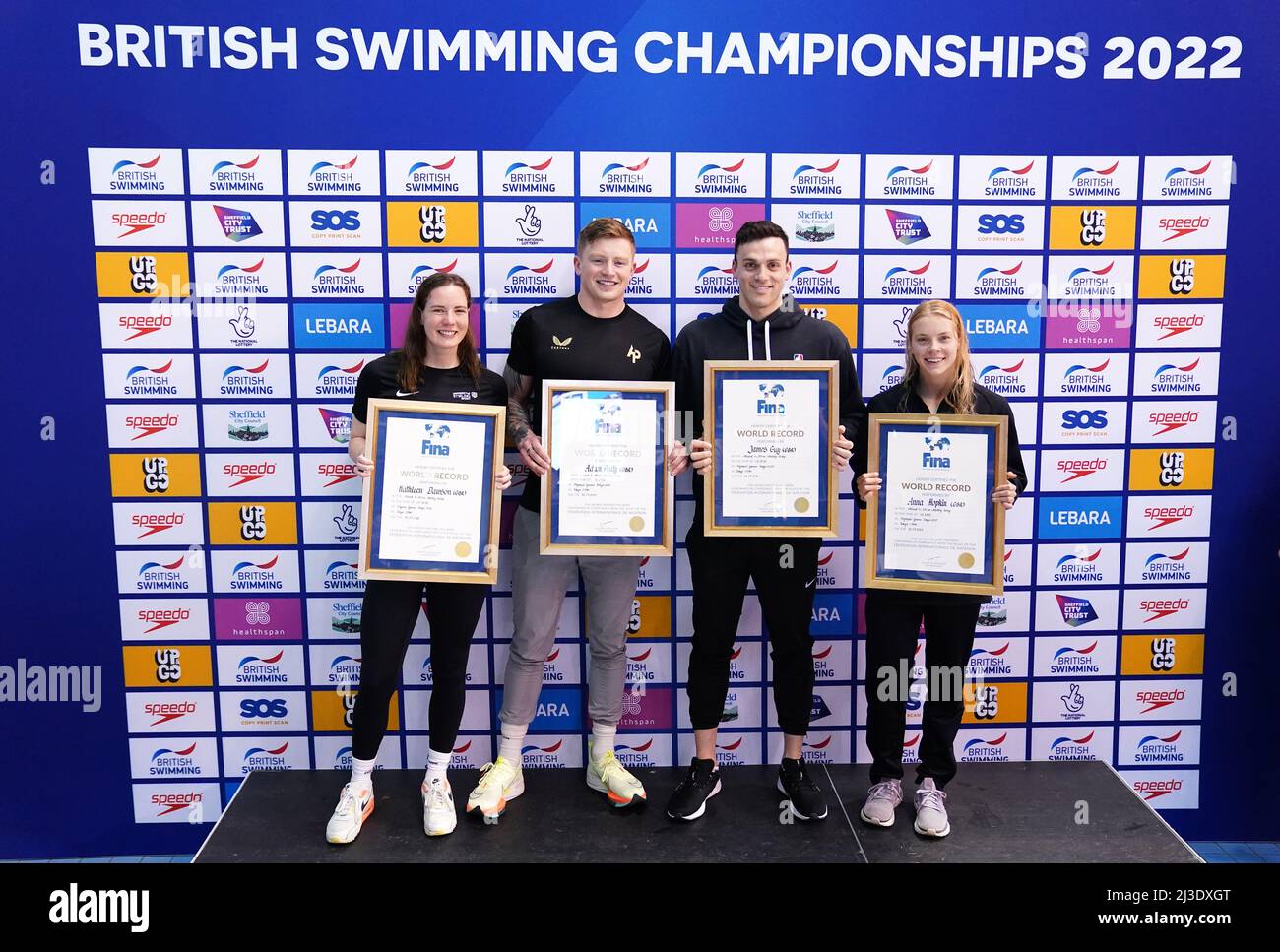 Great Britain's Kathleen Dawson, Adam Peaty, James Guy and Anna Hopkin are awarded their official certificates for setting a new world record in the Mixed 4 x 100m Medley Relay at the Tokyo Olympic Games during day three of the 2022 British Swimming Championships at Ponds Forge International Swimming Centre, Sheffield. Picture date: Thursday April 7, 2022. Stock Photo