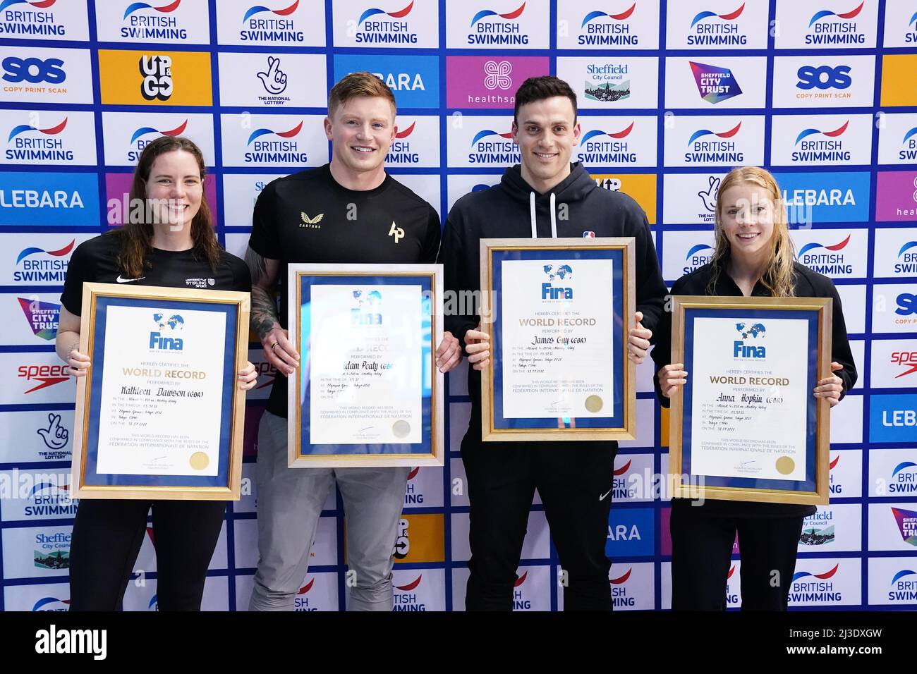 Great Britain's Kathleen Dawson, Adam Peaty, James Guy and Anna Hopkin are awarded their official certificates for setting a new world record in the Mixed 4 x 100m Medley Relay at the Tokyo Olympic Games during day three of the 2022 British Swimming Championships at Ponds Forge International Swimming Centre, Sheffield. Picture date: Thursday April 7, 2022. Stock Photo