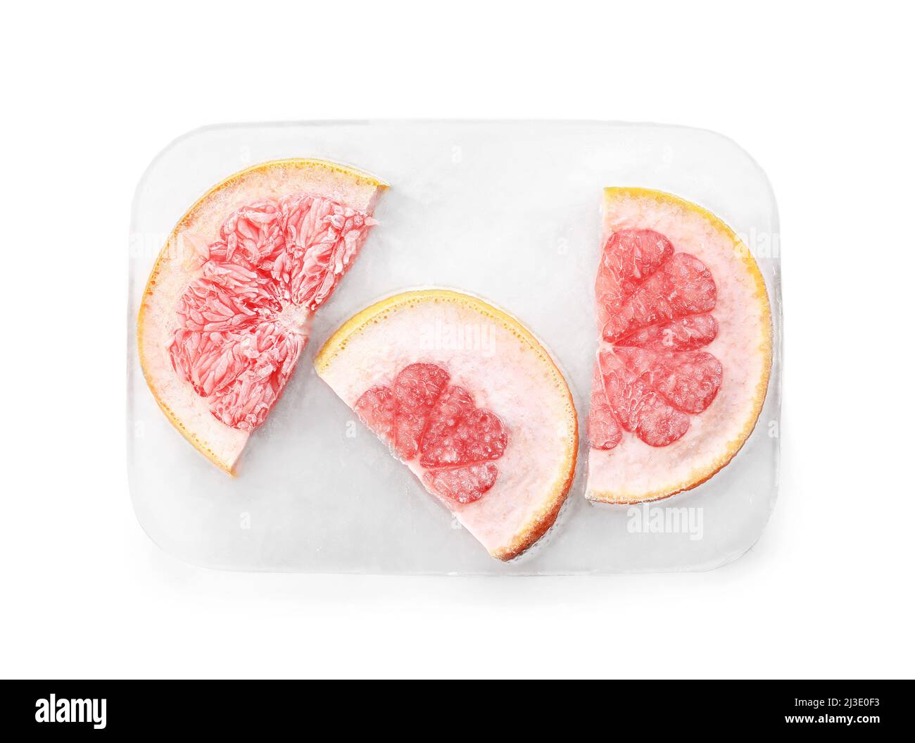 Fresh grapefruit frozen in ice on white background Stock Photo Alamy