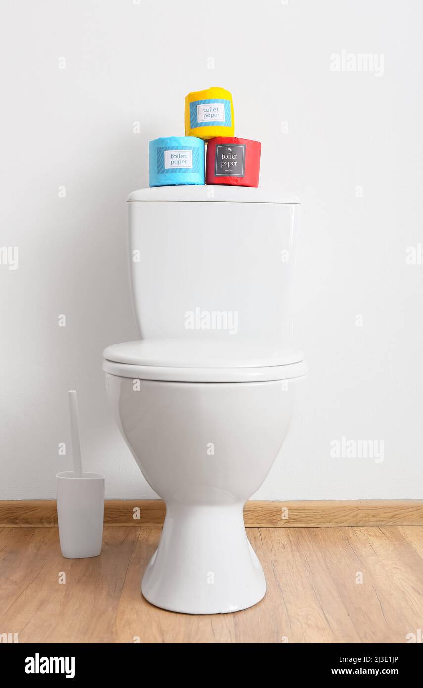 Interior of stylish restroom with toilet bowl and paper rolls Stock Photo Alamy