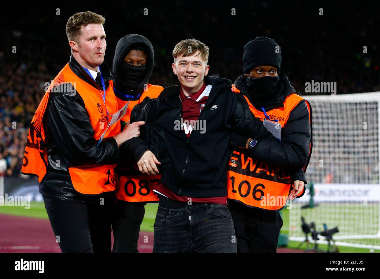 London, UK. 07th Apr, 2022. A West Ham United fan smiles as he is booed after invading the pitch during the UEFA Europa League Quarter Final first leg match between West Ham United and Lyon at London Stadium on April 7th 2022 in London, England. (Photo by Daniel Chesterton/phcimages.com) Credit: PHC Images/Alamy Live News Stock Photo