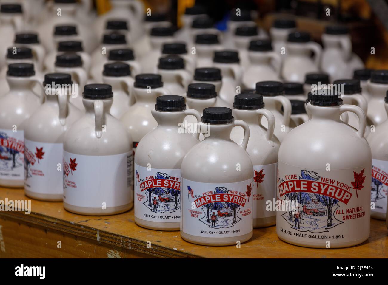 Freshly bottled maple syrup sits in a sugar shack: Cherry Valley, Otsego County, New York State Stock Photo