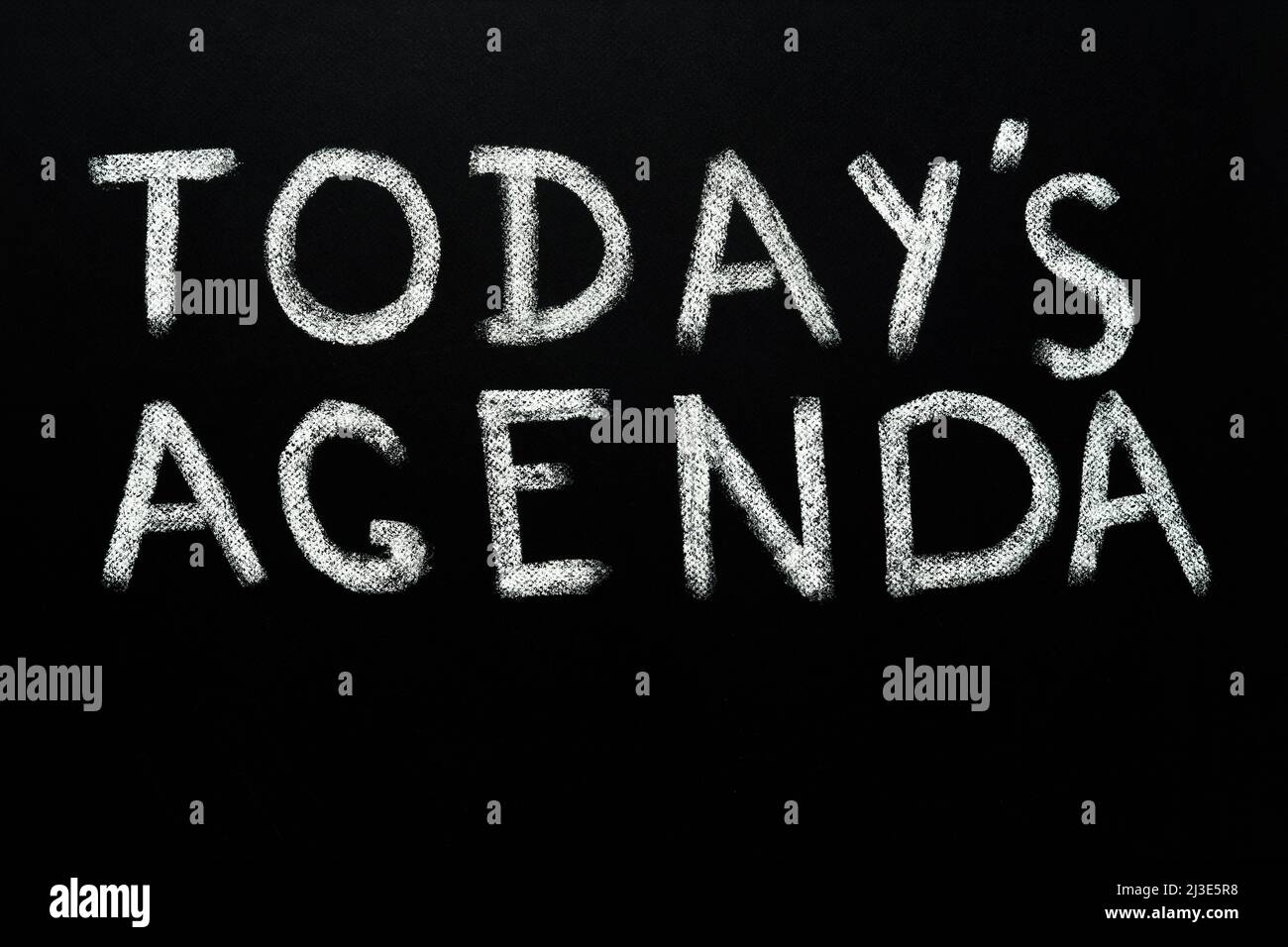 Handwritten words today's agenda background chalkboard texture background black board chalk text today's agenda design black chalkboard writing Stock Photo