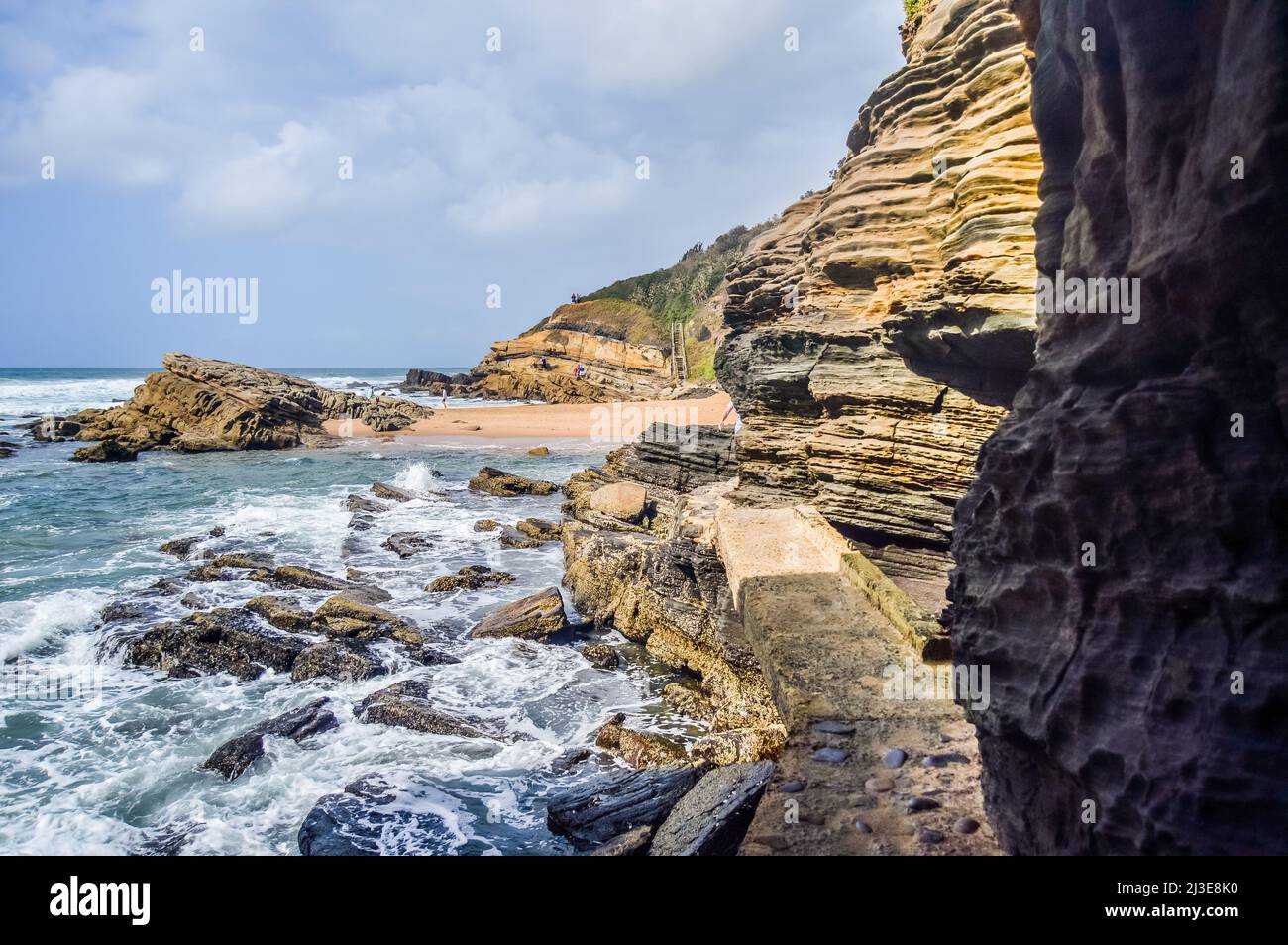Hole in the wall natural rock formation at Thompsons bay beach ballito South Africa Stock Photo