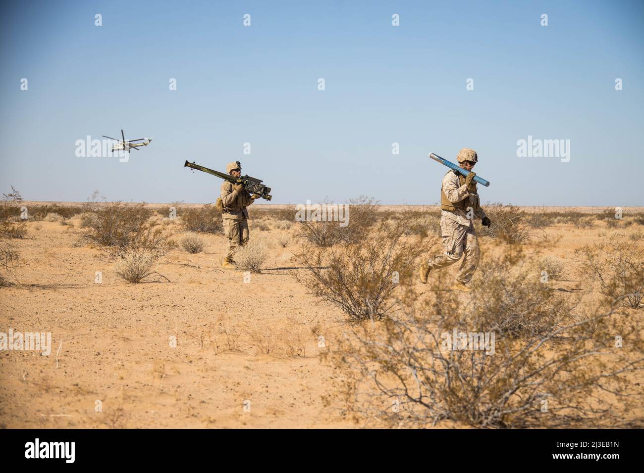 U.S. Marines with Ground Base Air Defense, Marine Aviation Weapons and Tactics Squadron One (MAWTS-1), move to a firing position, during Weapons and Tactics Instructor (WTI) course 2-22, at Auxiliary Airfield II, near Yuma, Arizona, April 5, 2022. WTI is a seven-week training event hosted by MAWTS-1, providing standardized advanced tactical training and certification of unit instructor qualifications to support Marine aviation training and readiness, and assists in developing and employing aviation weapons and tactics. (U.S. Marine Corps photo by Lance Cpl. Dean Gurule) Stock Photo