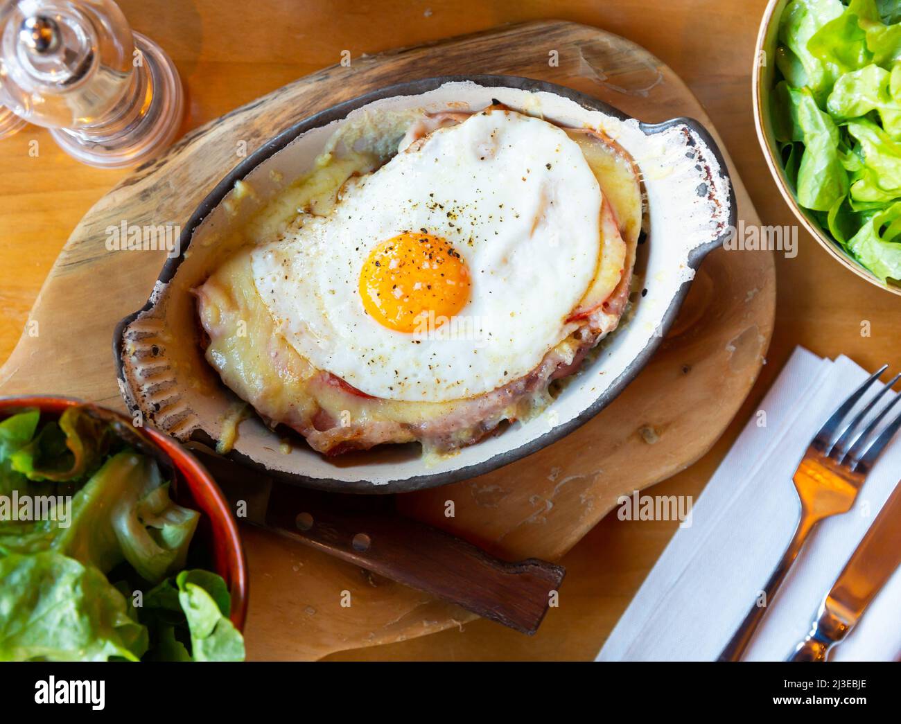 Swiss cheese crust with fried egg Stock Photo