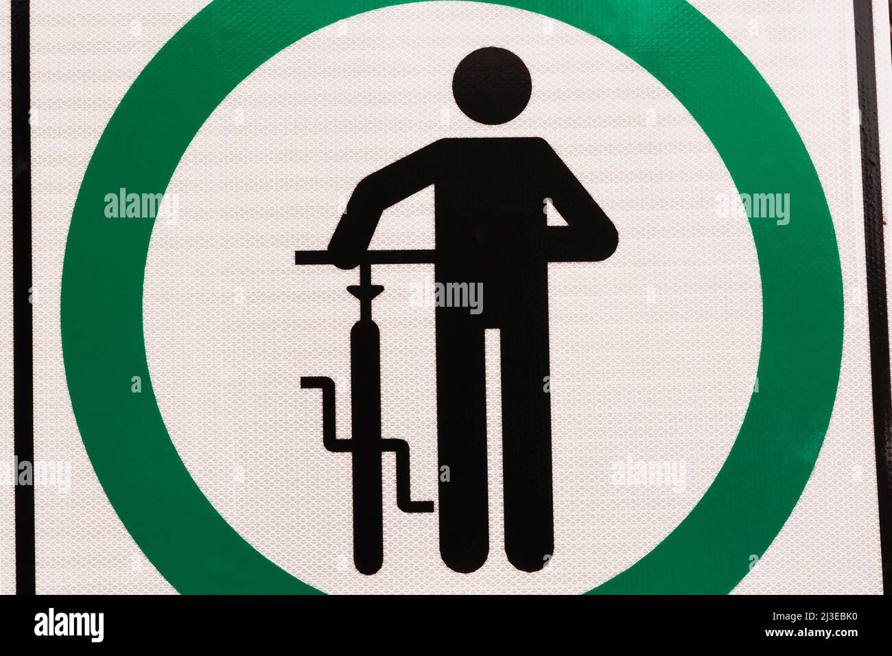 Black, green and white walk next to bicycle pictogram sign. Stock Photo