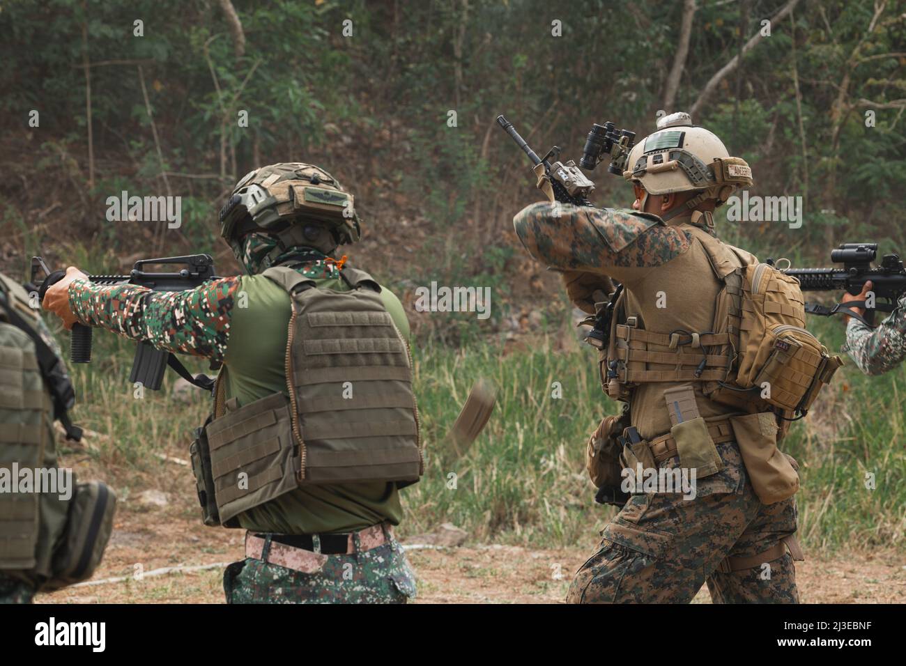 U.S. Marines with 3d Reconnaissance Battalion, 3d Marine Division, and Philippine Marines with Force Reconnaissance Group, conduct a close quarters battle range during Balikatan 22 at Marine Barracks Gregorio Lim, Cavite, Philippines, April 2, 2022. Balikatan is an annual exercise between the Armed Forces of the Philippines and U.S. military designed to strengthen bilateral interoperability, capabilities, trust, and cooperation built over decades of shared experiences. Balikatan, Tagalog for ‘shoulder-to-shoulder,’ is a long-standing bilateral exercise between the Philippines and the United St Stock Photo