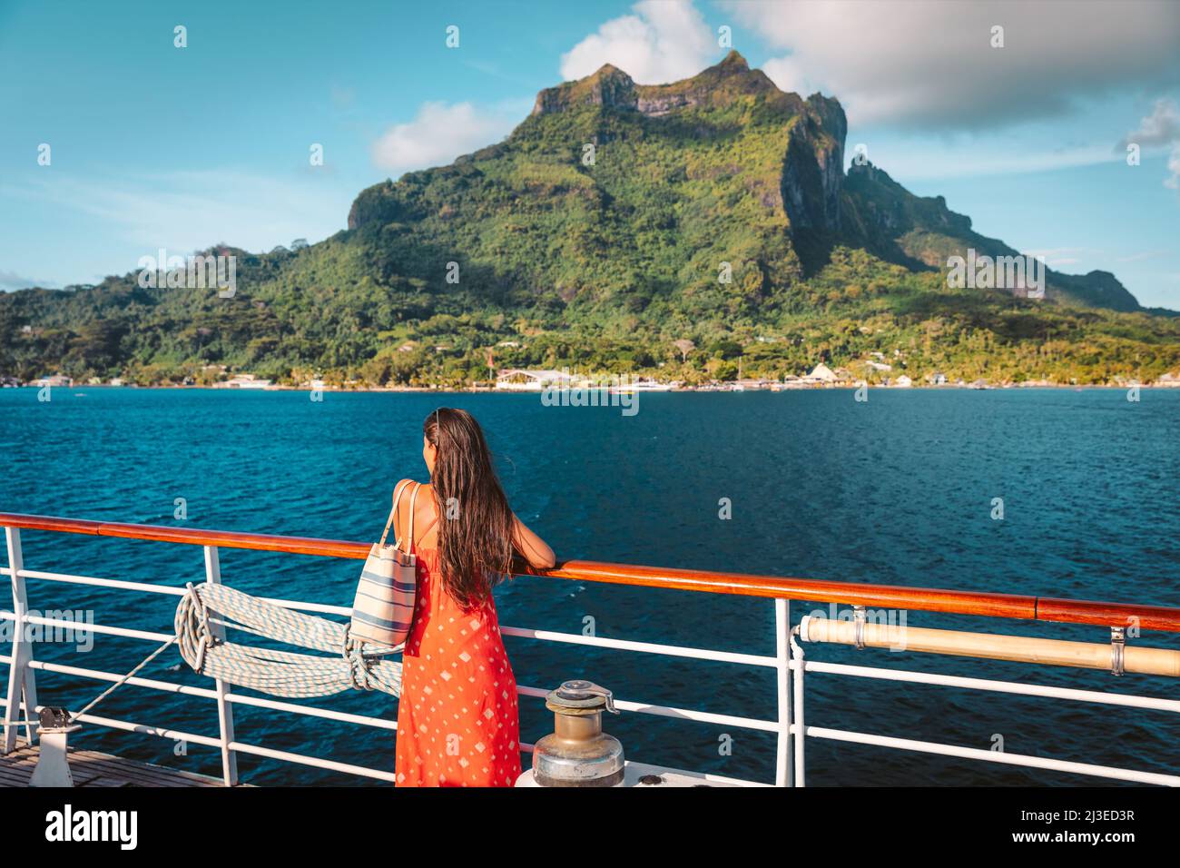Cruise ship travel vacation luxury tourist woman looking at Bora Bora