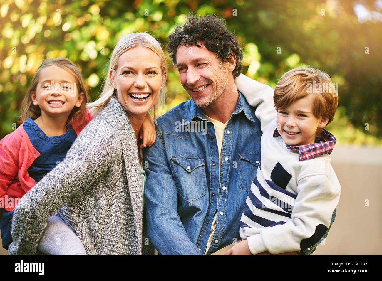 The best moments are those shared with family. Cropped shot of a happy family spending quality time together outside. Stock Photo