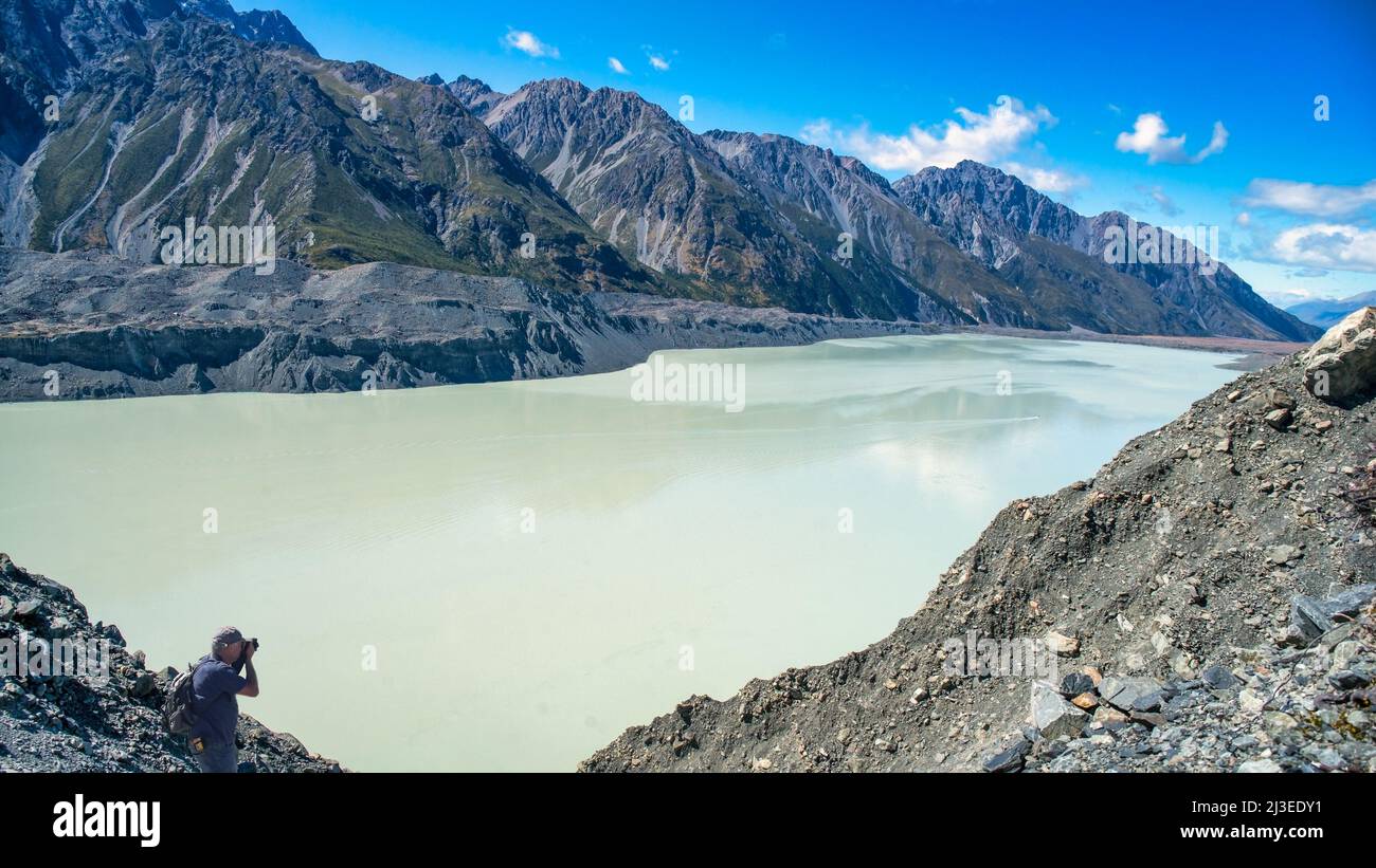 The remote far end of the Tasman alpine glacier lake where the lake meets the base of the Tasman Glacier Stock Photo