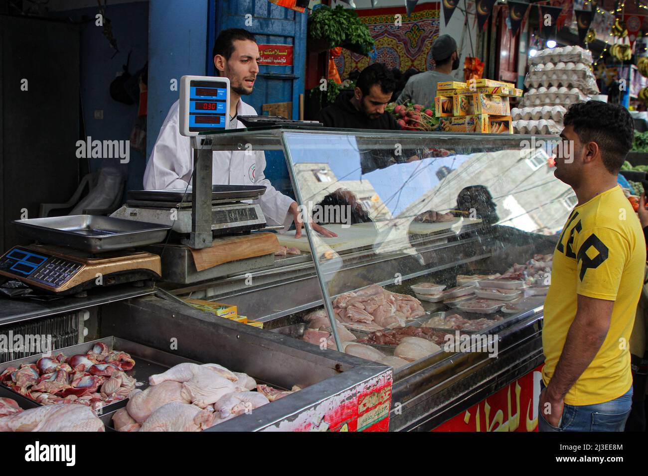 Gaza. 6th Apr, 2022. A vendor sells chicken meat at a market in Gaza