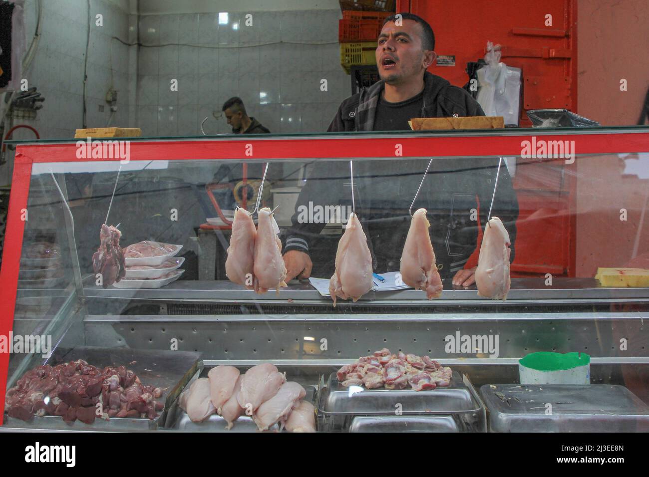 Gaza. 6th Apr, 2022. A vendor sells chicken meat at a market in Gaza