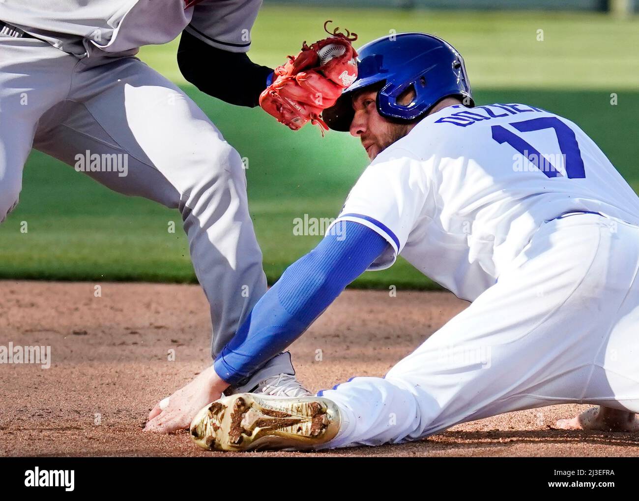 Apr 07, 2022: Kansas City Royals Hunter Dozier (17) slides under the tag at  second base