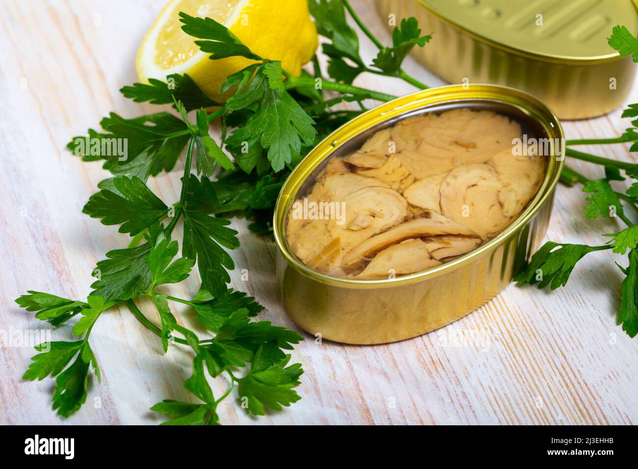 Tuna in oil with lemon and greens Stock Photo Alamy