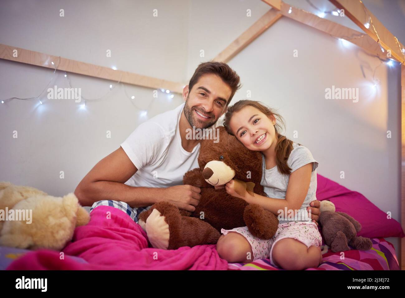 Dad always makes time to treasure with his little girl. Portrait of a father and his little daughter bonding together at home. Stock Photo