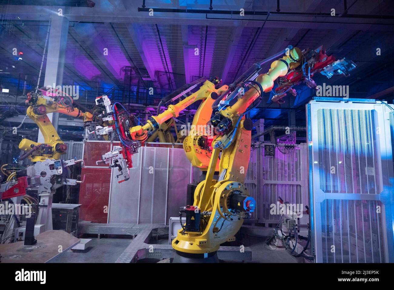 Tesla Asynchronous Machine Austin Texas USA, April 7 2022: Robotic machines line the manufacturing ...