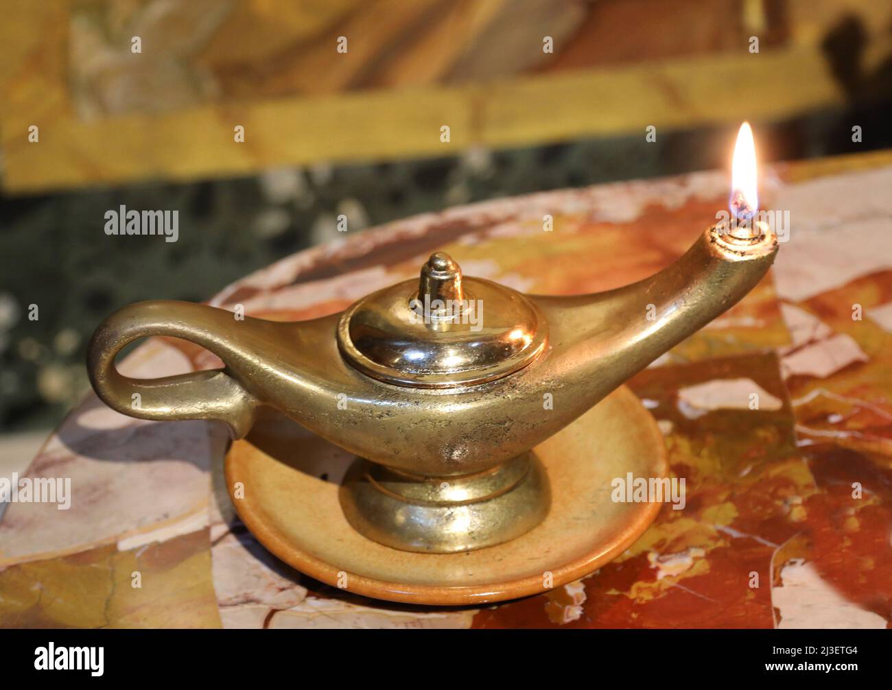 Ancient vintage golden oil lamp with flame that burn Stock Photo Alamy