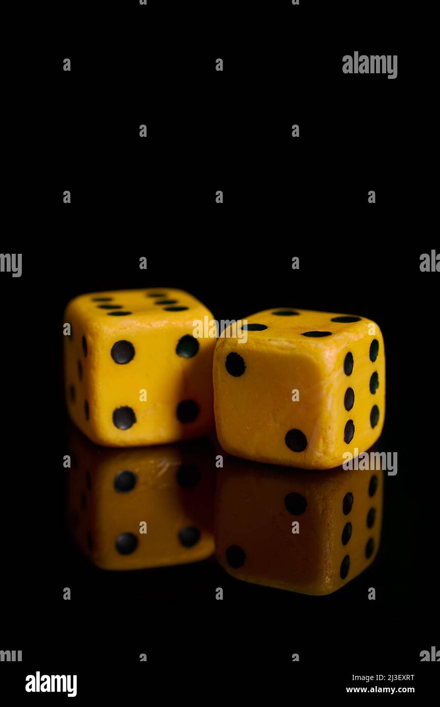Gambling. Two dice on a black background with reflection Stock Photo