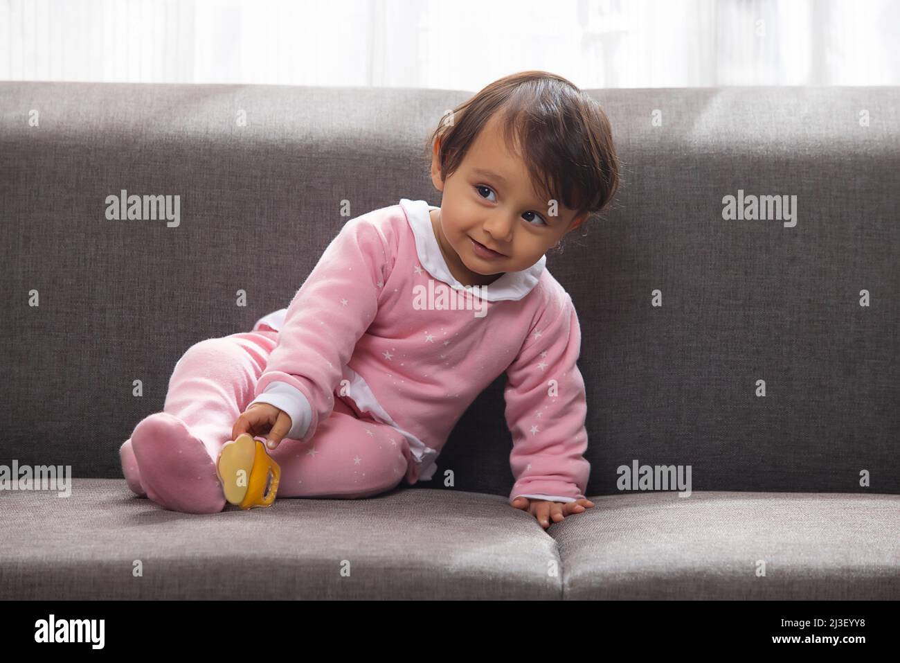 Side view baby sitting on hi-res stock photography and images - Alamy