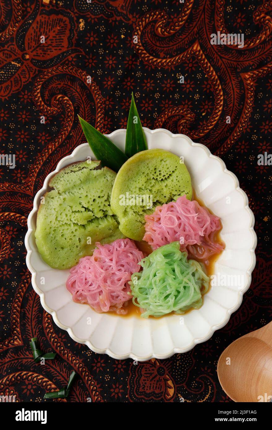 Pethulo, Srabi and Putu Mayang Served with Coconut Milk Palm Sugar Syrup, Traditional Indonesian Dessert from East Java. Top View Stock Photo