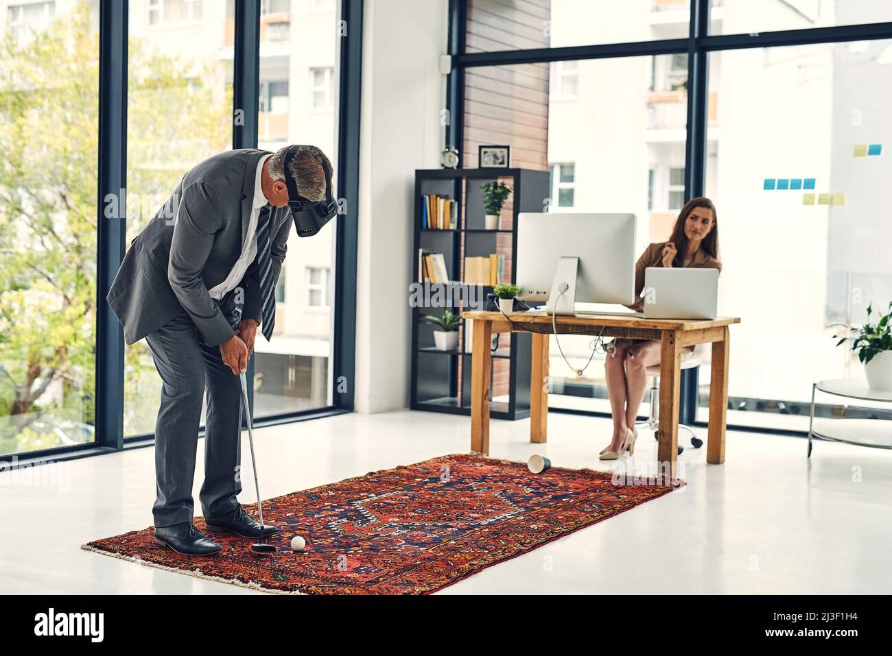 Its virtual game time. Shot of a businessman wearing a VR headset while
