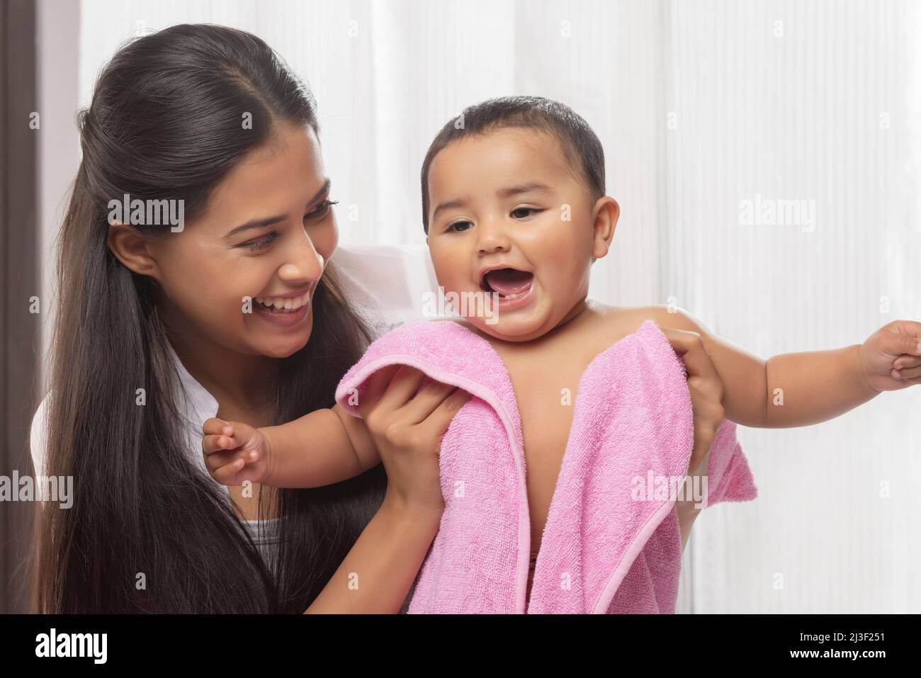 Mother wiping her baby after bath Stock Photo Alamy