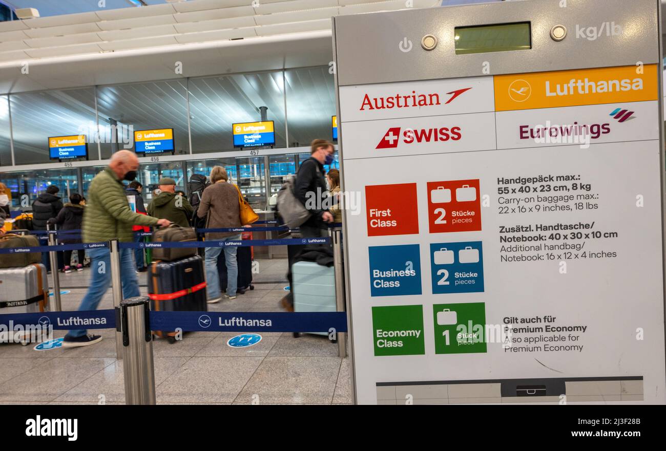 Munich, Germany. 08th Apr, 2022. Airline passengers stand at a check-in  counter at Munich Airport. Credit: Peter Kneffel/dpa/Alamy Live News Stock  Photo - Alamy