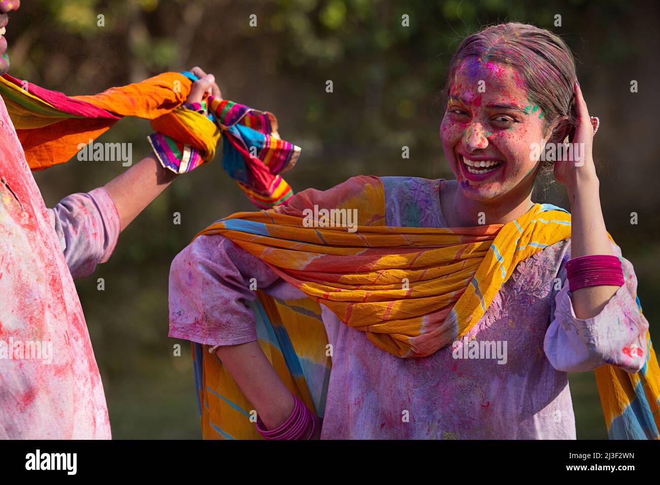 guy enjoying holi while driving