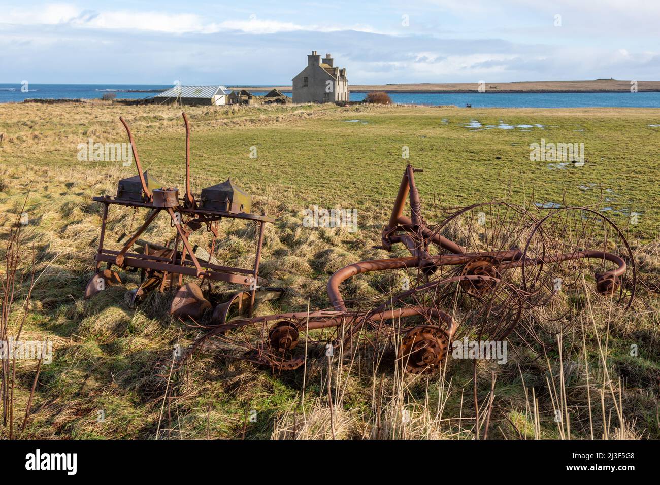Old rusty farm machinery on a remote farm, Papa Westray, Orkney Islands, UK Stock Photo