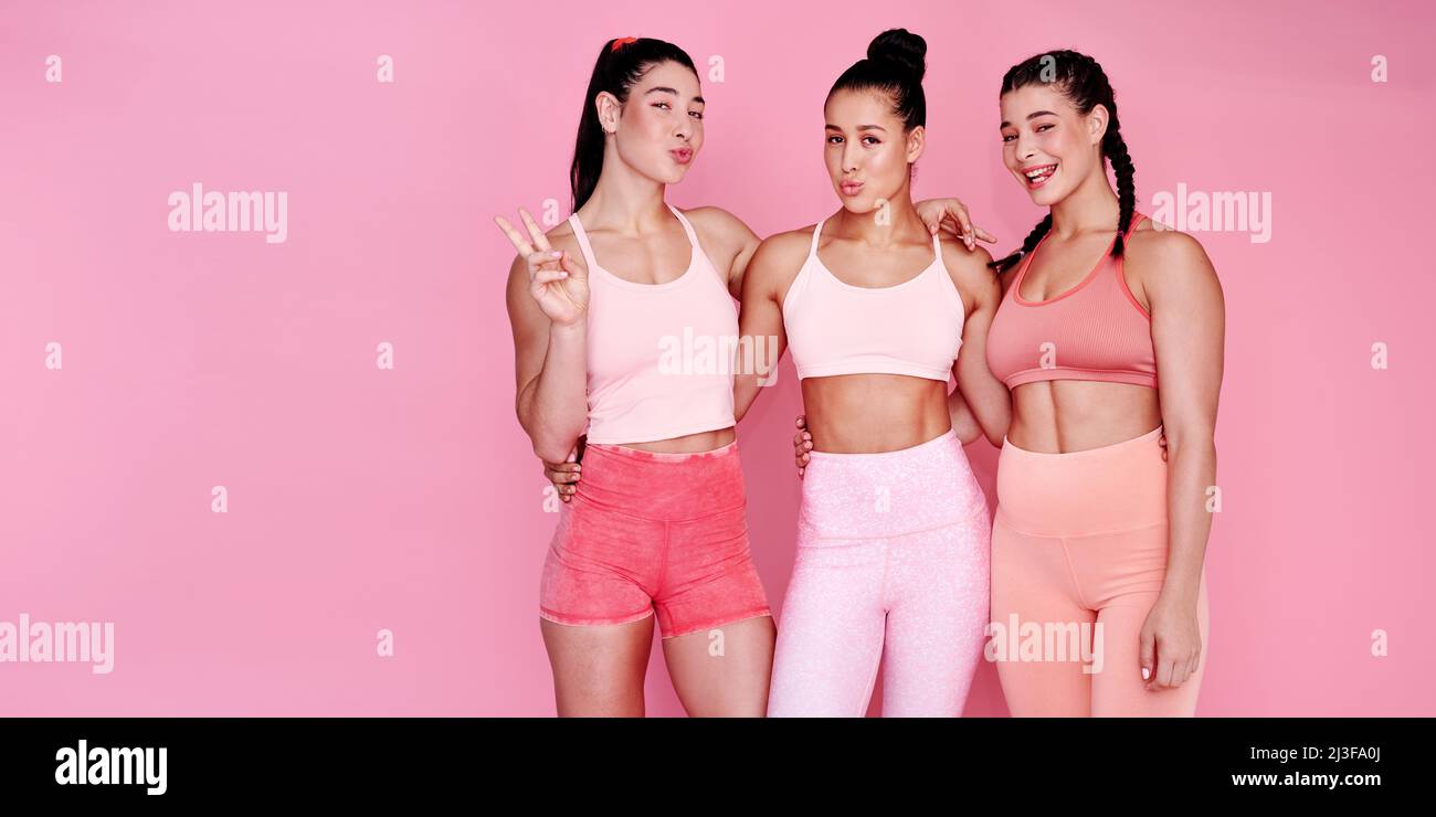 Its all about girl power. Studio portrait of a group of sporty young