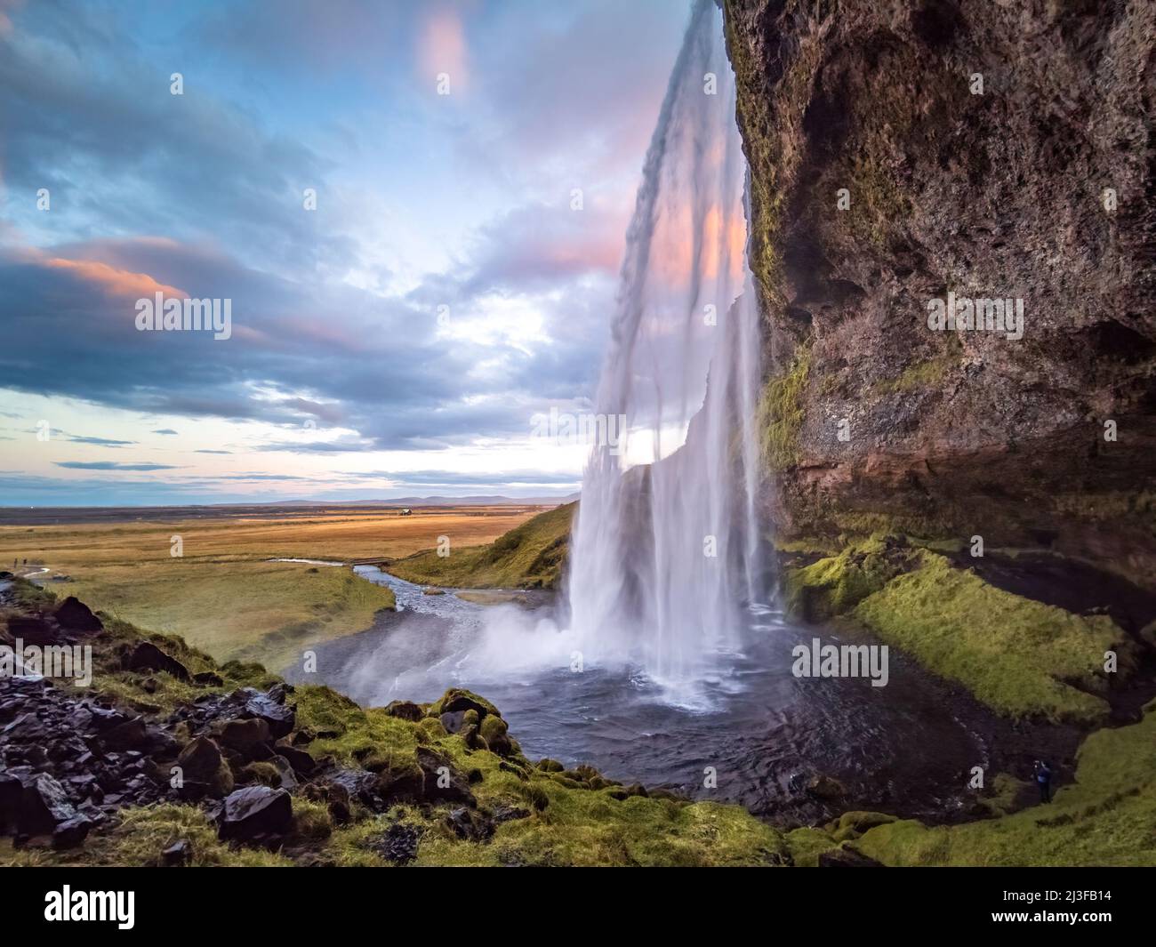 Seljalandsfoss waterfall wide angle at dawn in Iceland Stock Photo