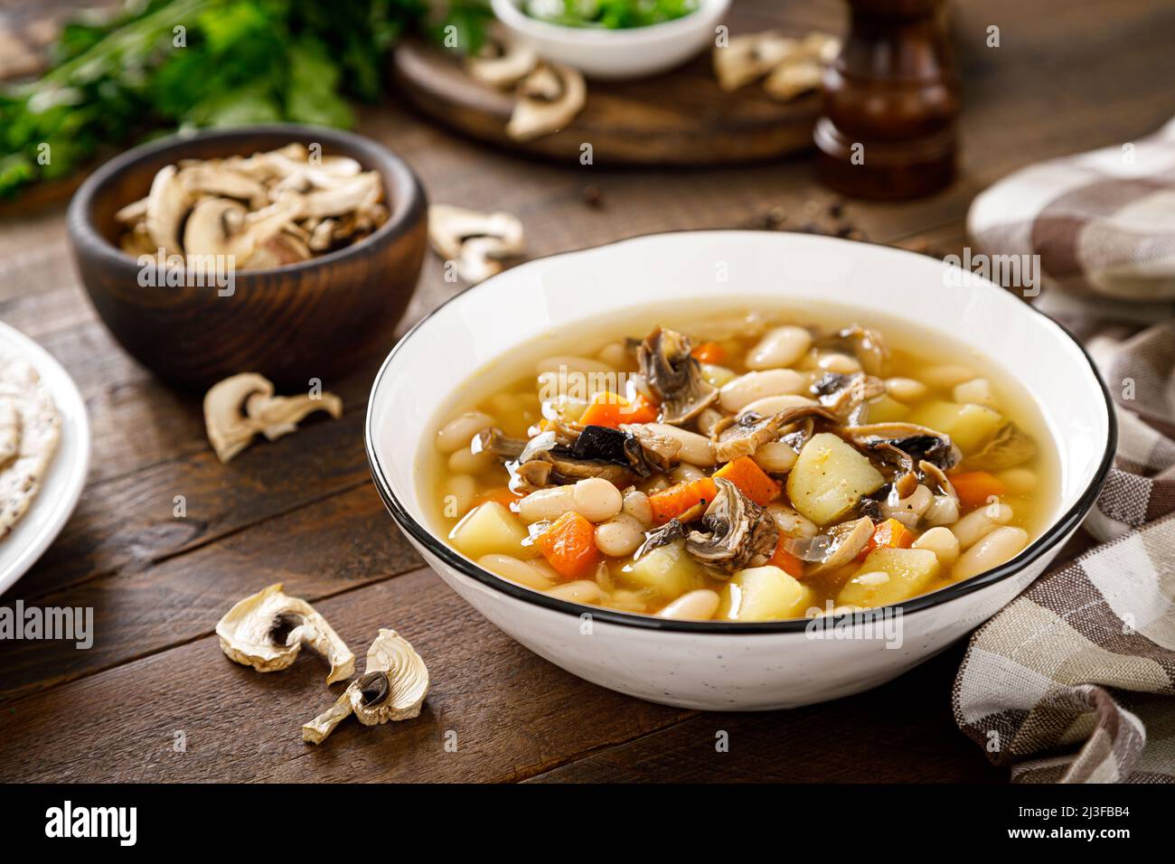 Mushroom soup with kidney bean, potato and carrot Stock Photo Alamy