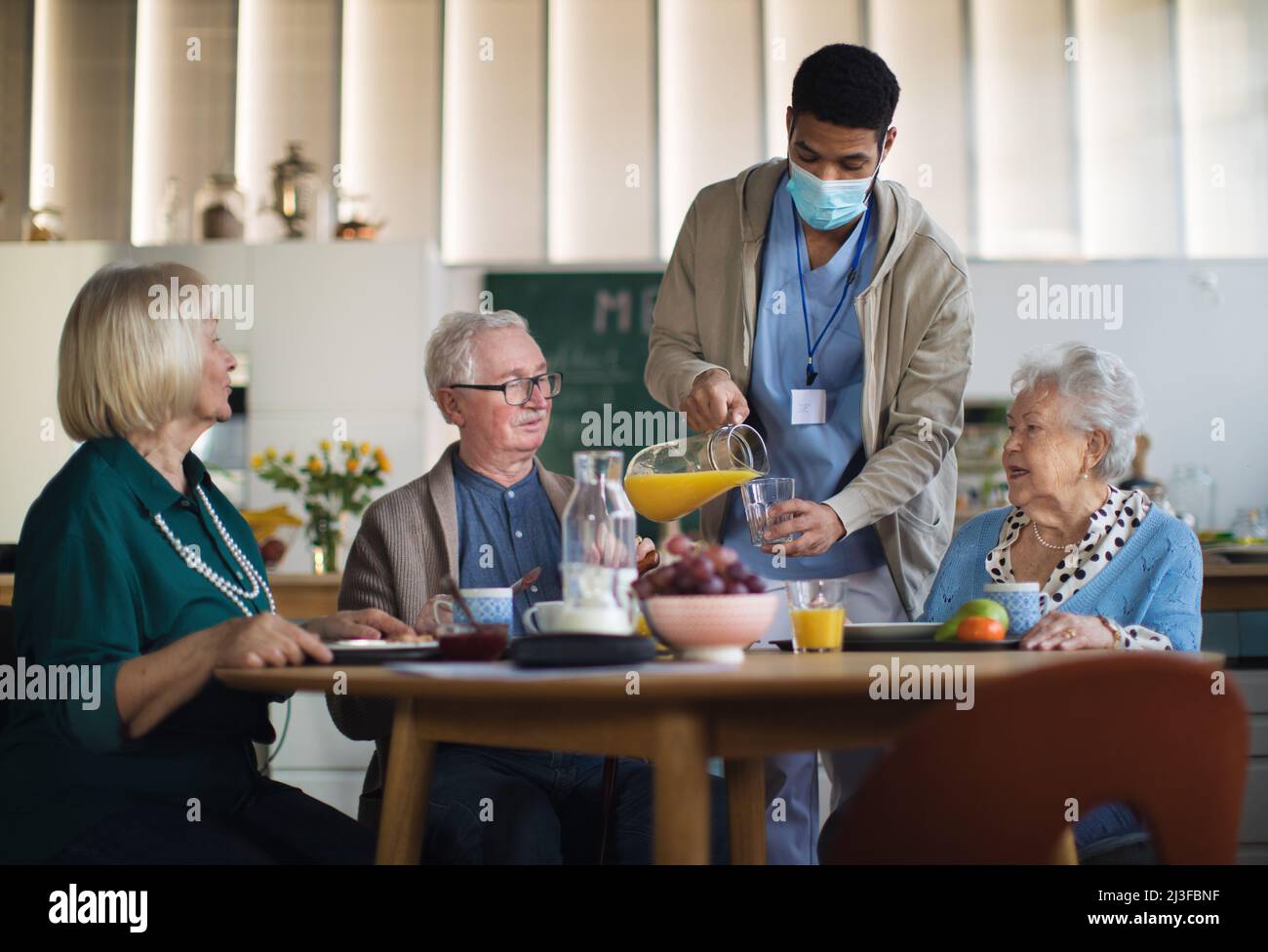 Group of cheerful seniors enjoying breakfast in nursing home care center Stock Photo Alamy