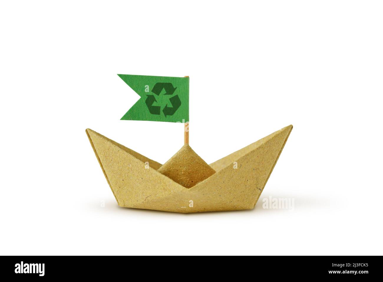 Origami recycled paper boat with recycling symbol on green flag - Concept of ecology and recycling Stock Photo