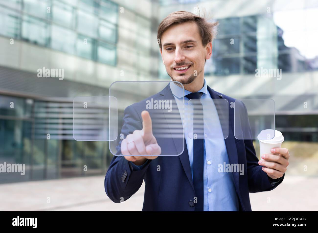 Man pressing icons on virtual touchscreen Stock Photo