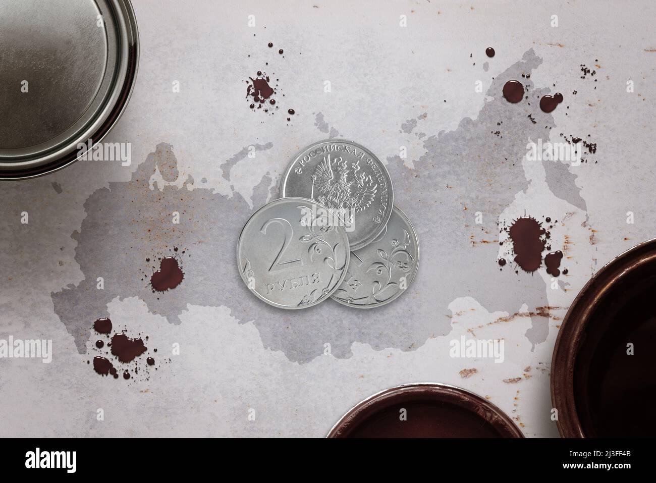 Russian ruble coins surrounded by buckets of oil on the map of Russia. Strengthening the Russian ruble and increasing energy exports is a concept Stock Photo