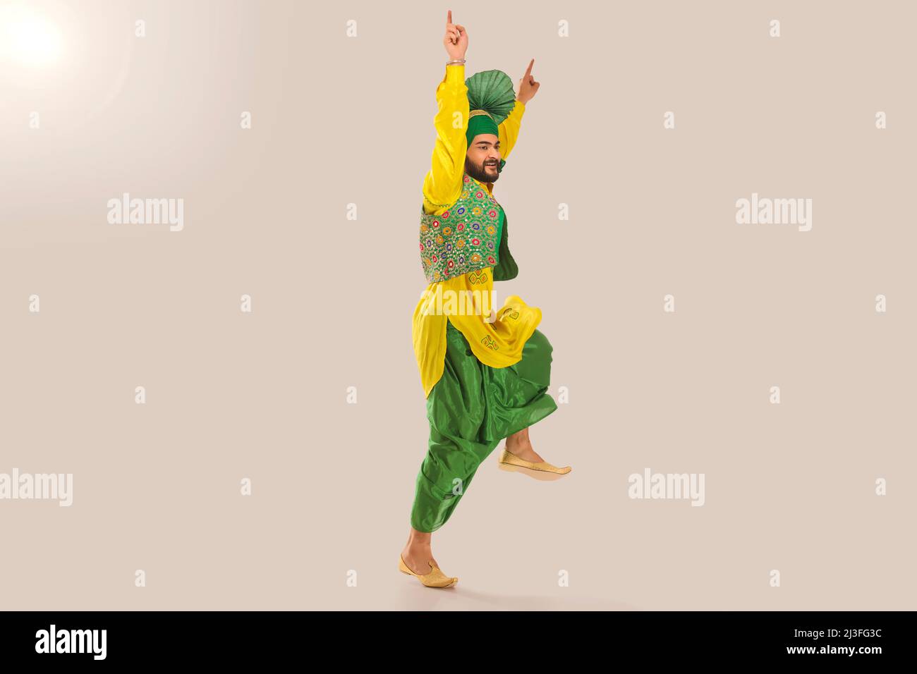Sikh Man performing bhangra during Baisakhi Celebration Stock Photo