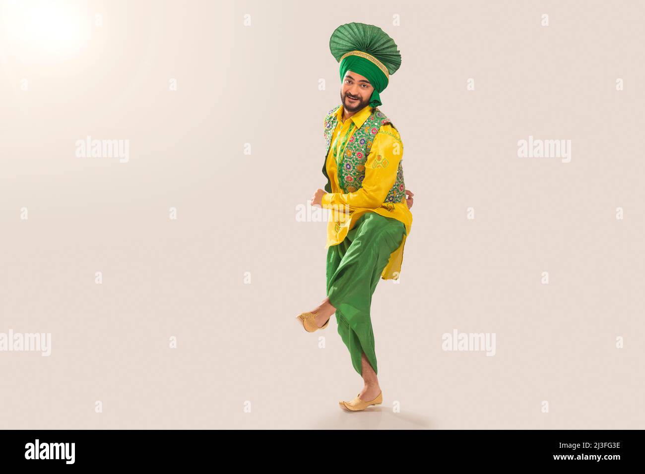 Sikh Man performing bhangra during Baisakhi Celebration Stock Photo