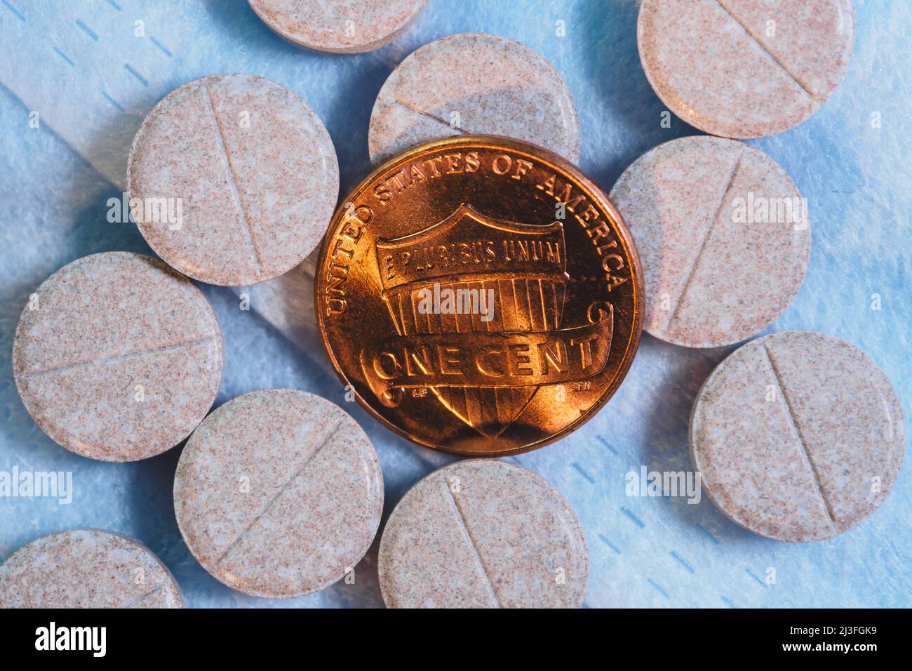 One usa cent coin with pills Stock Photo