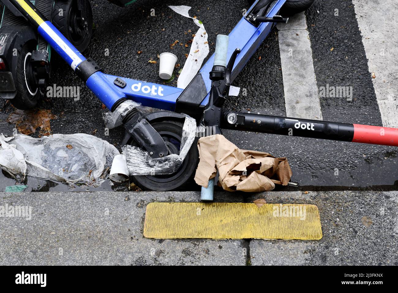 E-scooter thrown on the street - Paris - France Stock Photo