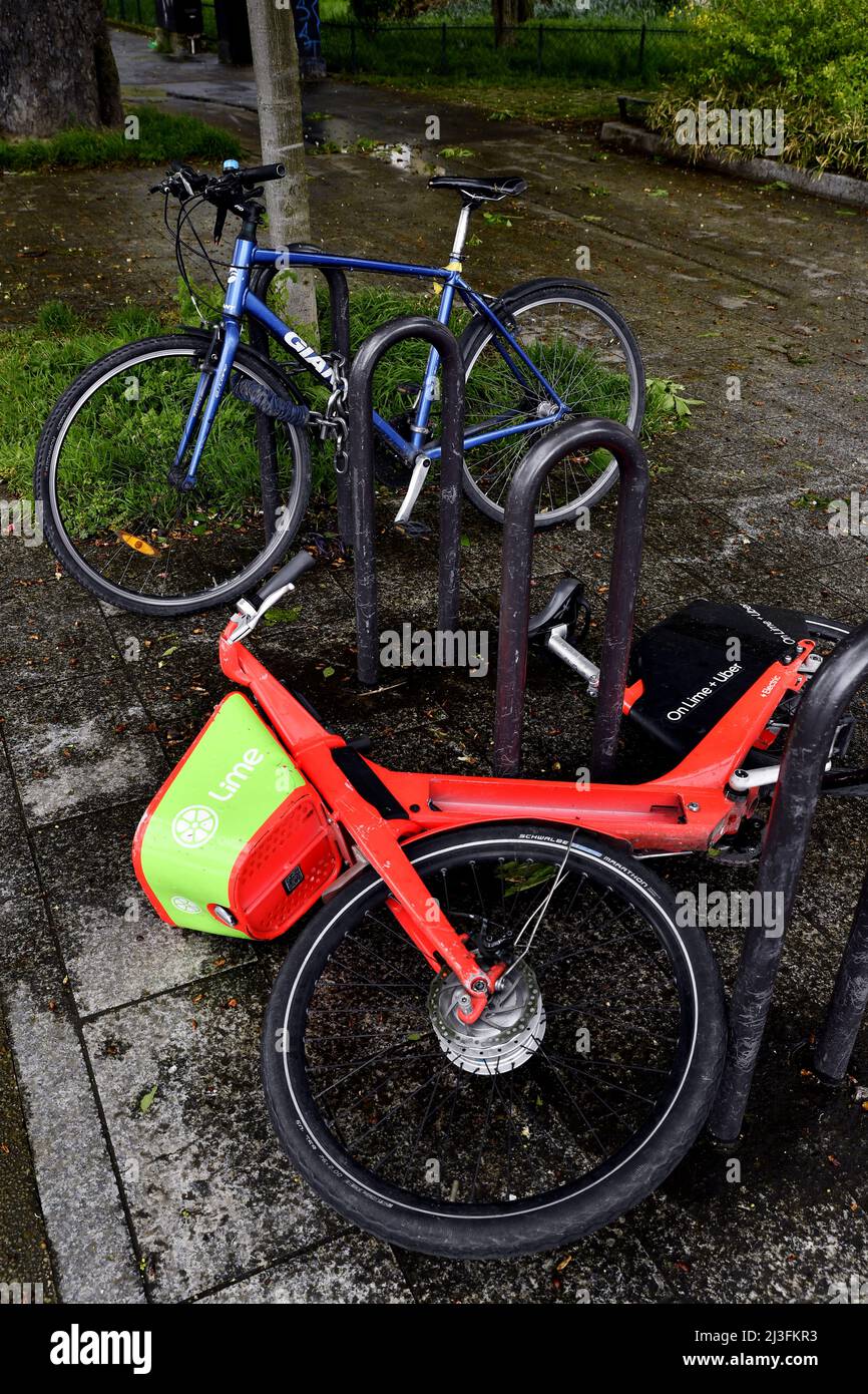 Ebike on the side walk - Paris - France Stock Photo