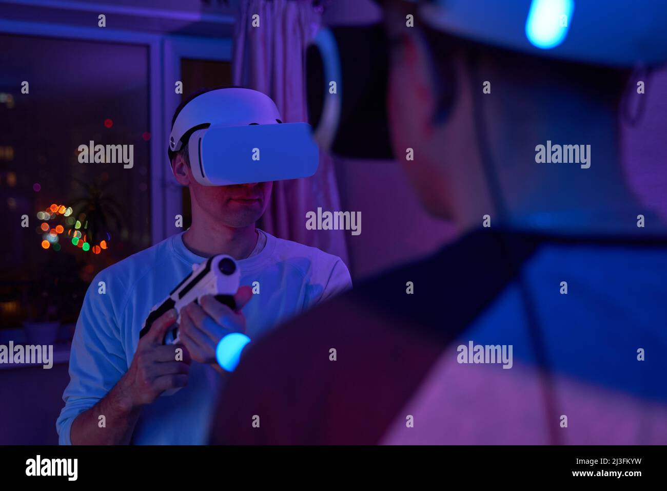 Two friends are playing virtual reality games and fighting each other