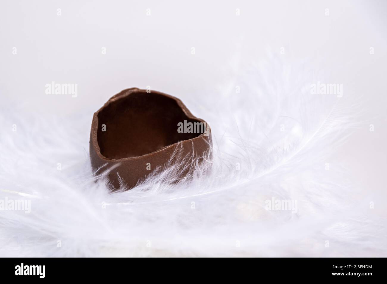 Chocolate easter egg with the top broken off Stock Photo - Alamy