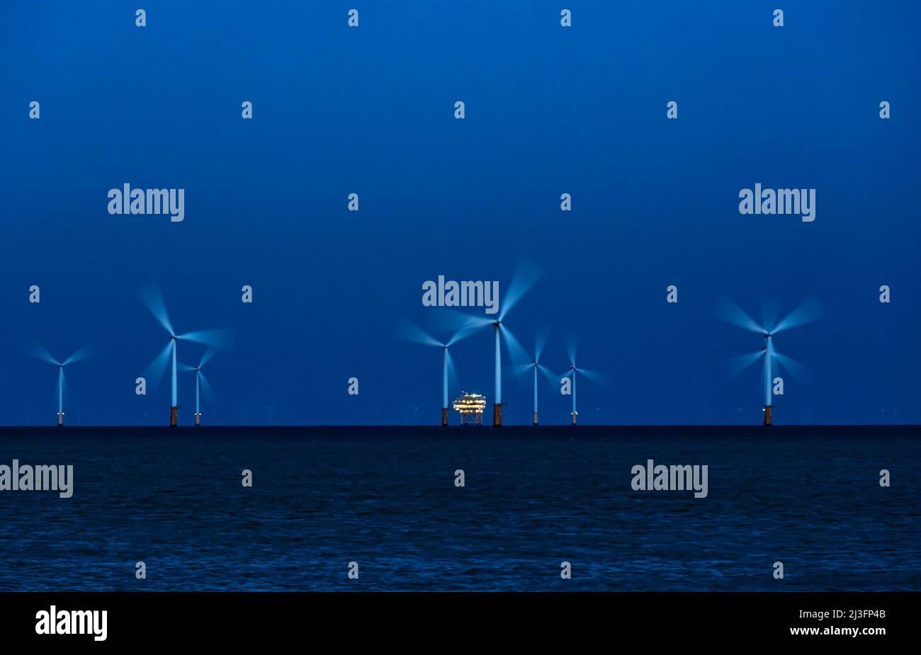 Wind turbines in sea - Stock Image