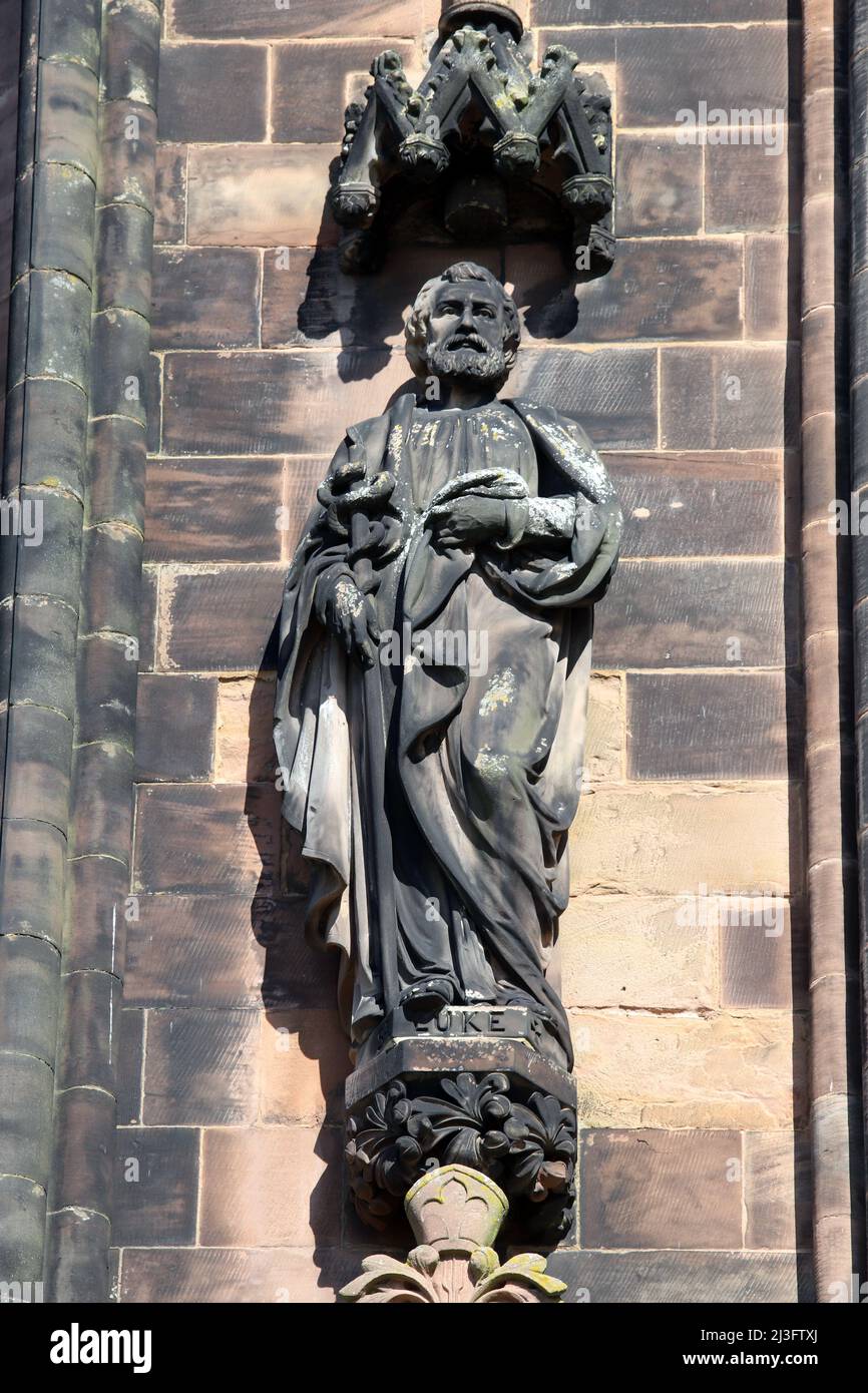 Statue of the Apostle Saint Luke on the west front of Lichfield Cathedral, Staffordshire, England Stock Photo