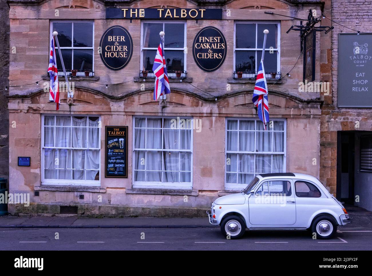 1972 Fiat 500 parked outside The Talbot Pub in Stow-on-the-Wold in the Cotswold's UK Stock Photo