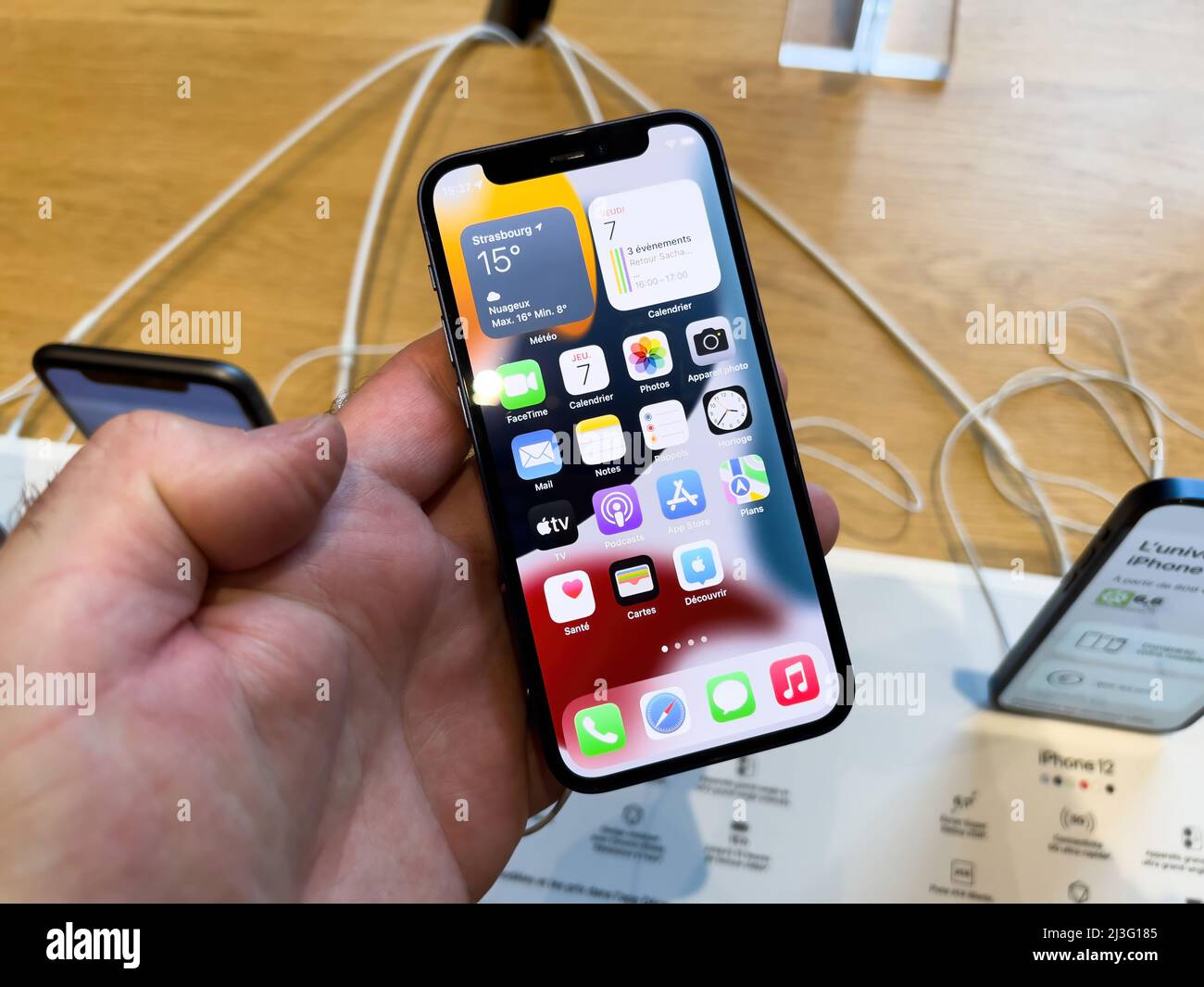 Paris, France - Ap 7, 2022: All Apps in male hand holding new latest Apple Computers iPhone SE smartphone with new CPU, 5G LTE internet connection and fast performance camera Stock Photo