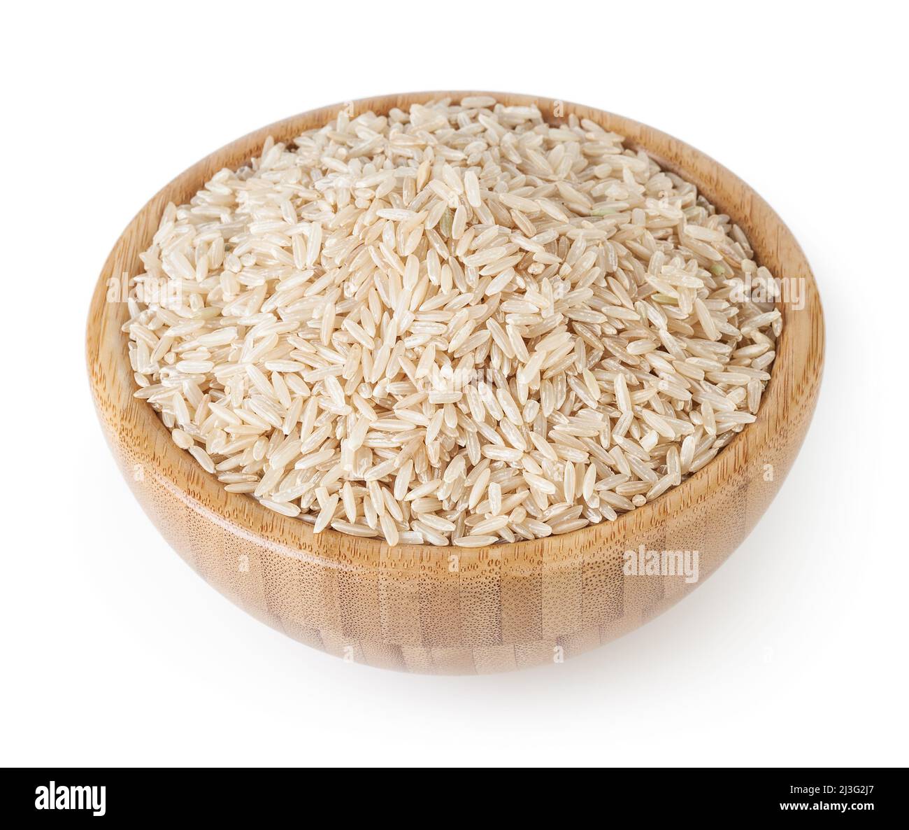 Brown rice in wooden bowl isolated on white background with clipping path Stock Photo